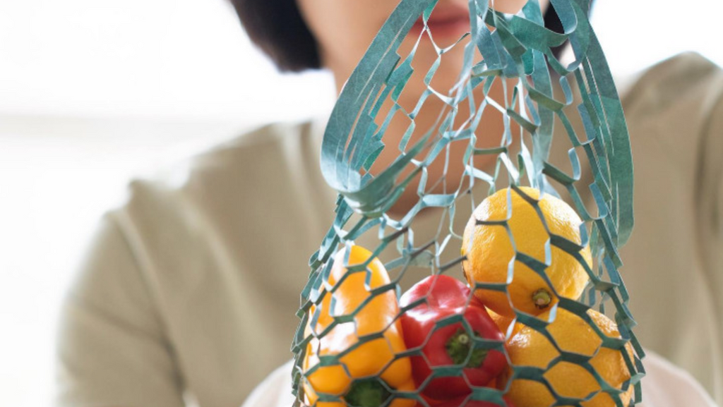 reusable, origami-inspired shopping bag that is made from recycled materials